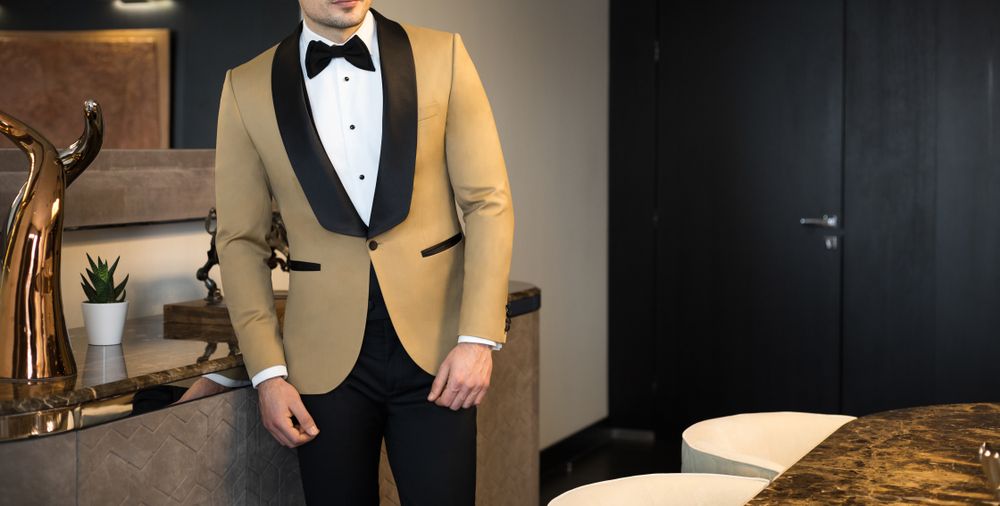 Black Bow Tie On A Tortilla Tuxedo Jacket With Black Tuxedo Pants